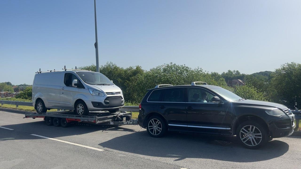 Silver Ford Transit Custom being transported