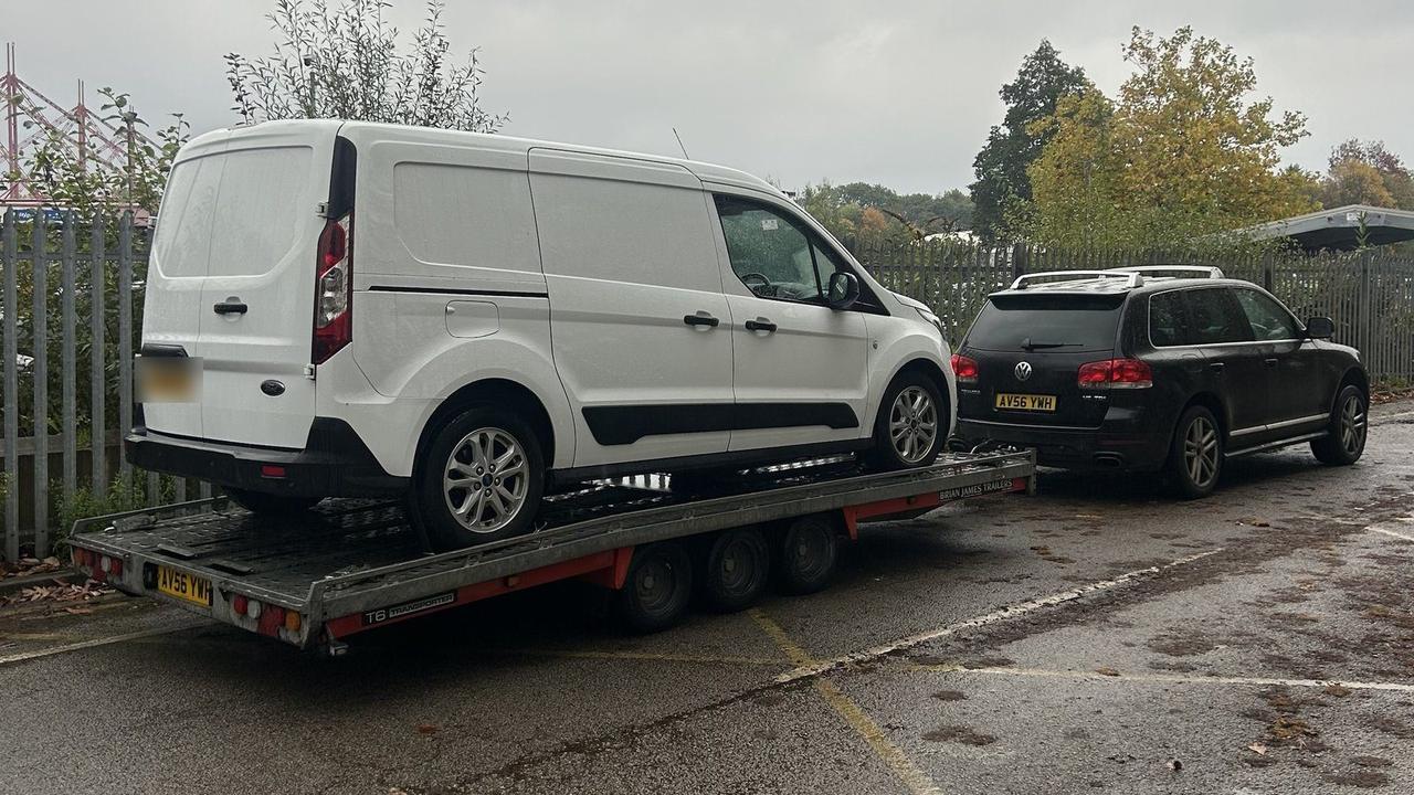 White Ford Transit Connect on the trailer